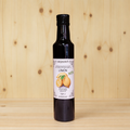 Aceite de limón, frontal, botella real, fondo de madera