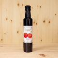 Aceite de oliva virgen extra aromatizado con Tomate BIO AGRISANZ, vista frontal cuadrada con fondo de madera clara